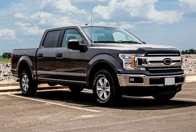 Black pickup truck with blue sky