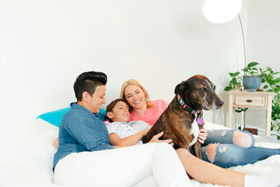 Family hanging out with their dog